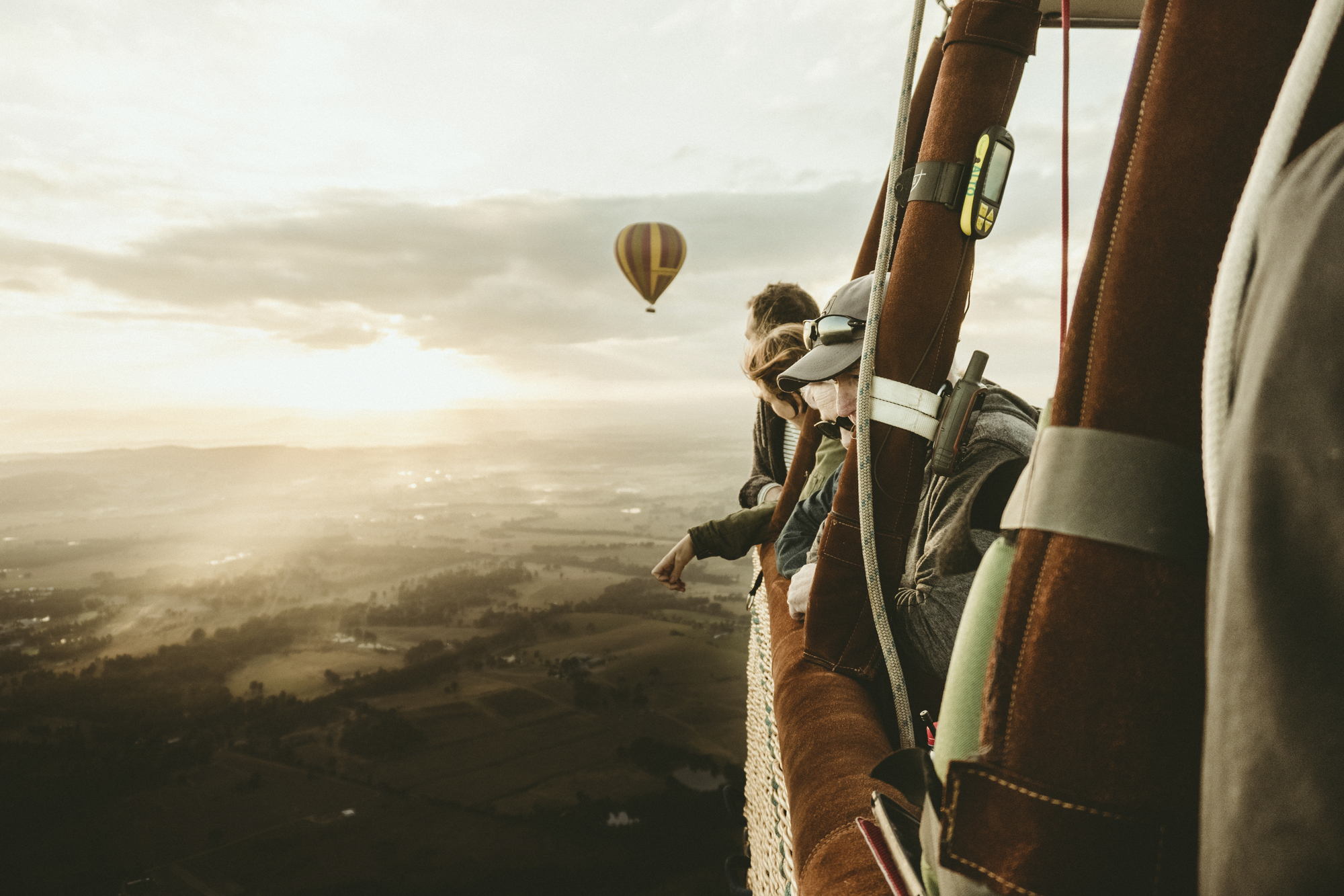 People enjoying a hot air balloon ride over the Hunter Valley.